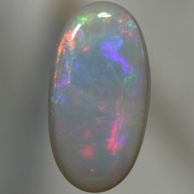 SOLID SEMI BLACK OPAL Rolling flashes of red and neon orange to magenta and purple
